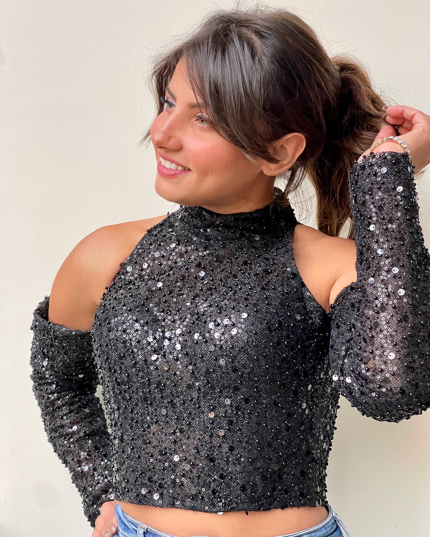 Black off-shoulder bustier with pearls